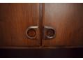 Round handles made by Brdr Boisen on rosewood 3 door wall unit.