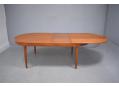 Extending Mogens Kold dining table with 2 fold-away leaves in teak.