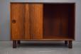 Midcentury rosewood cabinet with sliding doors for sale