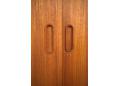 Solid teak carved handles inset in all doors make each door easy to slide.