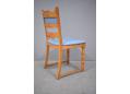 New light blue upholstered dining chair with light oak frame.