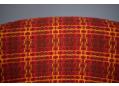 Red-orange patterned fabric upholstery is clean and odour free.