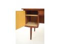 The left bay contains a storage space with a single shelf & cupboard door.