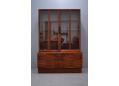 Vintage rosewood glass door display cabinet by Ib Kofod Larsen. SOLD
