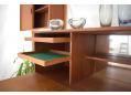 The cabinets contain an assortment of drawers, shelves & a drop.