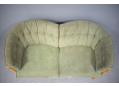 2 seat curved back sofa made in Denmark with green fabric upholstery. 