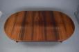 Round top rosewood dining table extending with 2 extra leaves produced by Heltborg Mobler