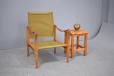 Kaare Klint design SAFARI chair in ash with canvas seat and back rest and leather arm rests produced by Rud Rasmussen Cabinetmaker