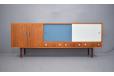 Midcentury teak sideboard with sliding doors than can be alternated 