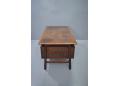 Rosewood desk with 2 locking drawers and minimalist design.