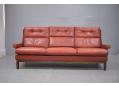 Retro 3 seater with original dark red ox leather and wood legs in dark oak