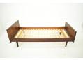 Midcentury rosewood framed single bed with tapering round legs.