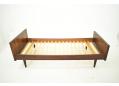 Midcentury rosewood framed single bed with tapering round legs.