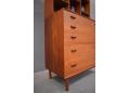 The solid teak construction is evident in all areas including the sculpted handles.