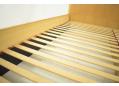 Solid beech slats lay on rails to give flexible mattress support.