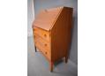 Midcentury design polished nutwood bureau with various storage spaces. 