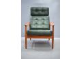 High back armchair with original green leather upholstery. France & son model 164
