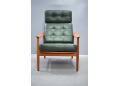 High back armchair with original green leather upholstery. France & son model 164