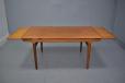 Vintage teak dining table with 2 pull out leaves designed by Johannes Andersen
