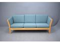 Danish modern design 3 seat light blue fabric sofa with beech ends. SOLD