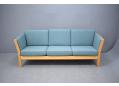 Danish modern design 3 seat light blue fabric sofa with beech ends. SOLD