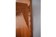 The unique dowl locking system which secures shelves and cabinets to the panel