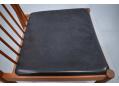 Black leather upholstered Helge Sibast dining chair in teak.