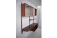 Wall mounted storage system in vintage roswwood