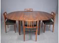 192cm long when fully extended, rosewood dining table with round top 