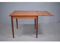 Danish dining table with square top and 2 draw leaves to seat 6