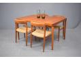 A stylish table here shown with Niels Moller design chairs model 75