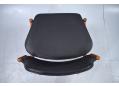 Black leather upholstered model 462 dining chair in teak.