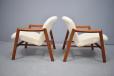 Stylish teak framed armchairs with warm alpaca wool upholstery