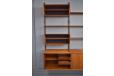 Vintage teak wall mounted cabinets and shelves by Poul Cadovius