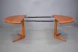 4 Seater teak dining table produced in 1970 with 2 extra leaves for sale