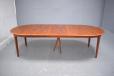 Oval dining table with 3 extra leaves inserted. All leaves have matching plinth