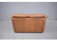Small frame Skalma 2 seat sofa in mottled brown leather made in Denmark.