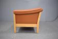 Beech show frame on tan leather upholstered 2 seat sofa.