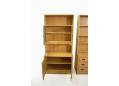 Shelf storage within Danish made oak wall units with coloured glass doors.