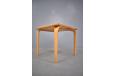 Minimalist leg frame on Danish side table in solid beech.