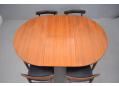 Extended table now comfortable to seat 6. Extends with fold-out leaf hidden in table