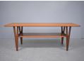 Midcentury design large coffee table with teak magazine shelf.