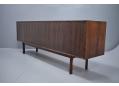 The back is also in rosewood, allowing the sideboard to be used in the middle of a room.