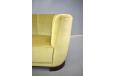 Small cured sofa in green velour upholstery made in Denmark 1940s