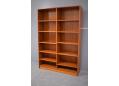 Tall bookcase in teak with adjustable shelves made in Denmark.