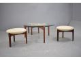 Sizeable 3 legged stools with padded and upholstered seats are comfortable 