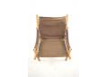 Corded hammock seat with brown leather cushion.