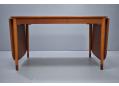 Teak drop leaf dining table with beech legs. Borge Mogensen design.