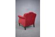 Red velour upholstered armcahir with carved wood details made by Danish Cabinetmaker
