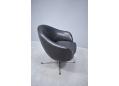 Danish low back swivel chair in black leather with chrome swivel base.